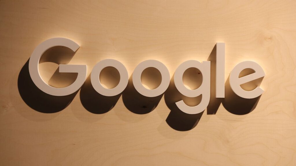 A wooden Google logo hangs at a stand at the 2022 Re:publica digital society festival on June 09, 2022 in Berlin, Germany.