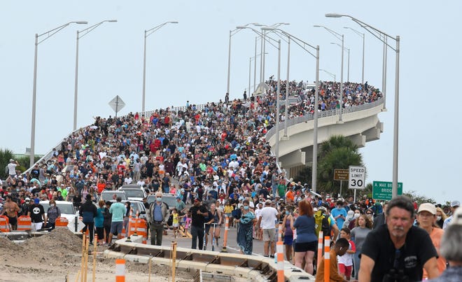 Huge crowds of launch spectators on the A. Max Brewer Bridge in Titusville return to their vehicles in May 2020 after scrubbing the historic SpaceX Demo 2 flight, the first manned American mission in nearly a decade.