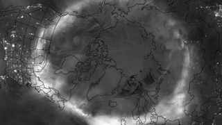 A black and white photo of the Northern Hemisphere showing where the auroras were on May 11.