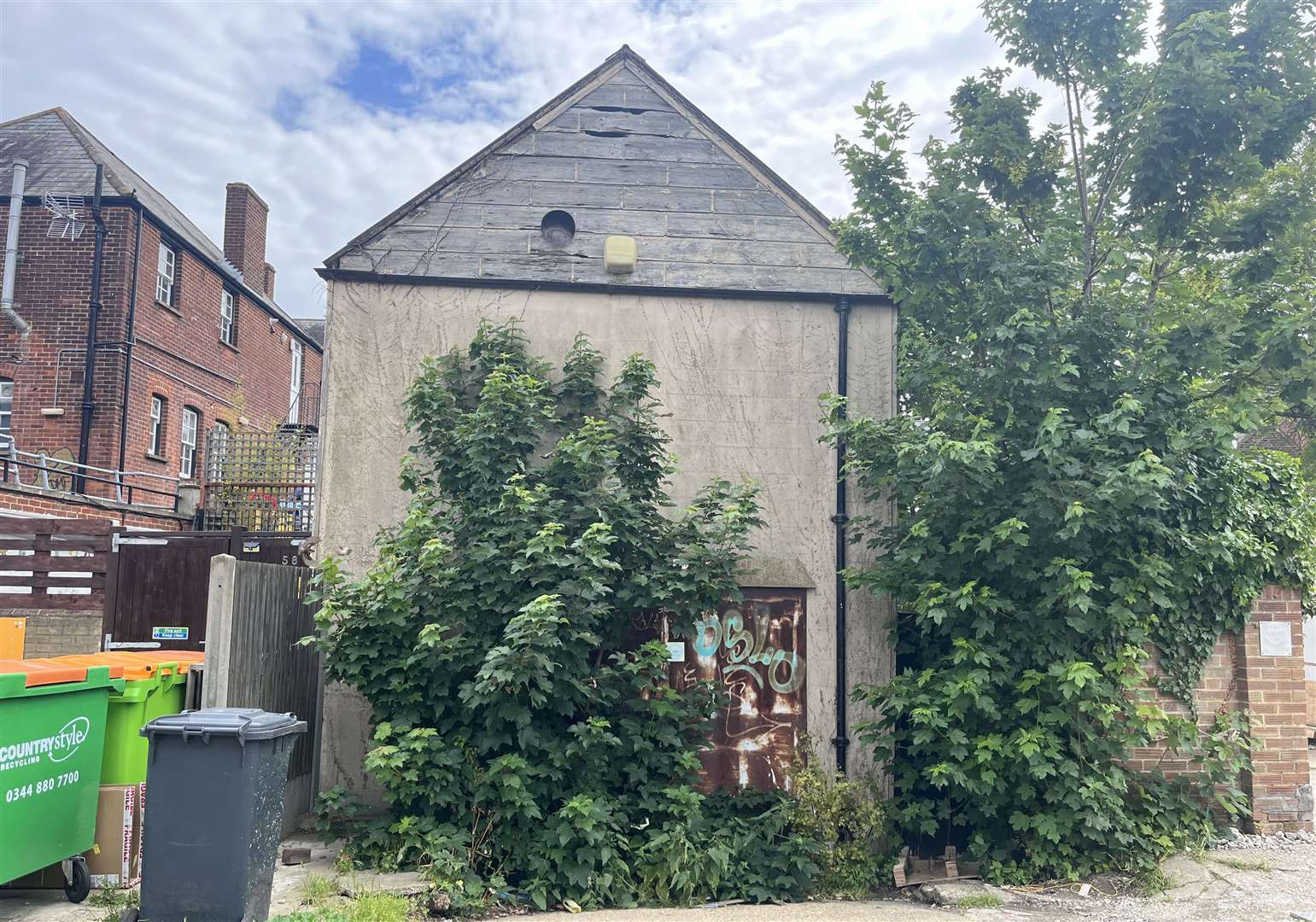 The old warehouse at the rear of the site in Whitstable High Street is to be demolished as part of the three-apartment proposal.